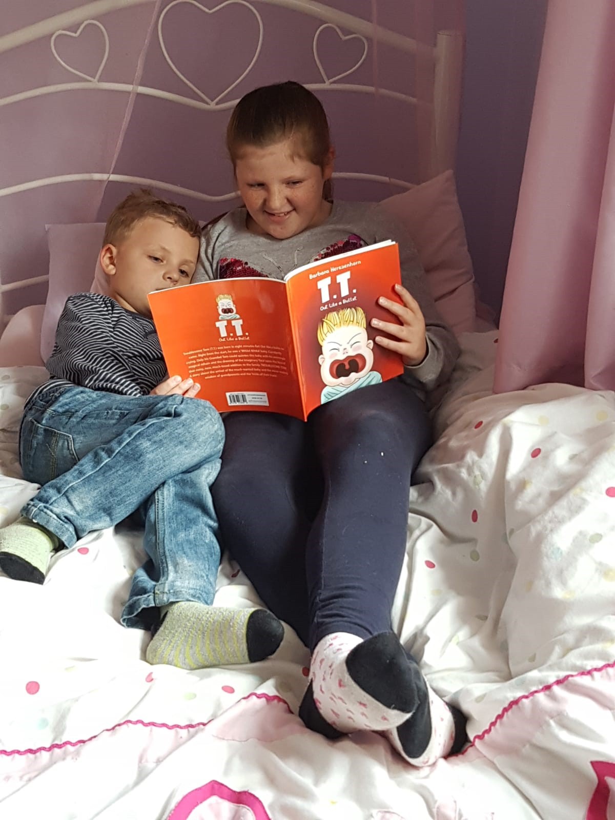 Two young fans reading the book Troublesome Tom, 27-Oct-18