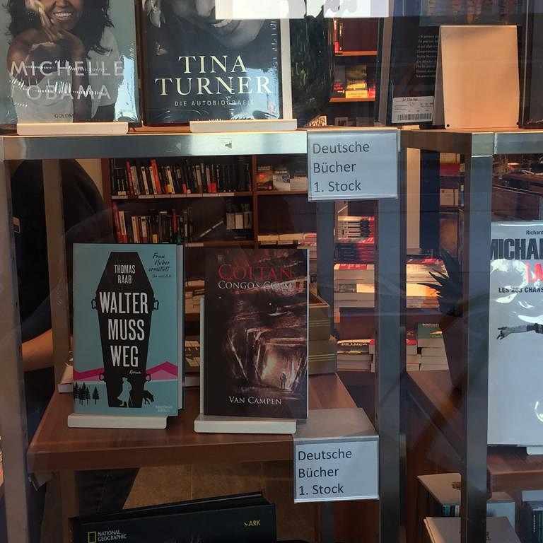 Coltan, Congo's Curse by Van Campen Featured in Bookshop Window Display Coltan, Congo's Curse by Van Campen Featured in Bookshop Window Display