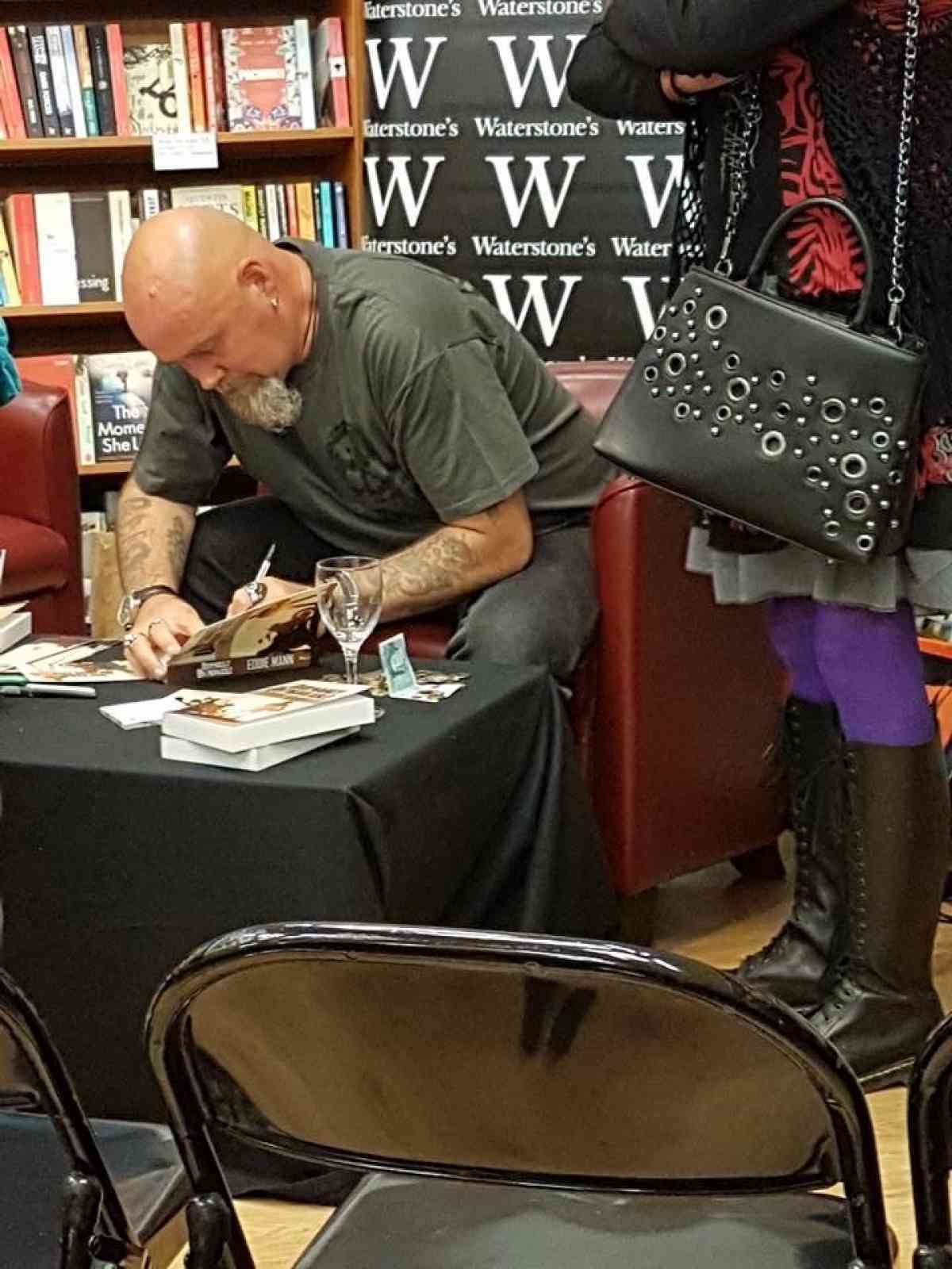 Signing his book after the book reading